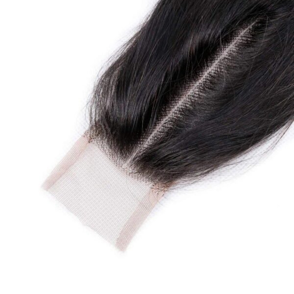 Detailed texture of jet black straight human hair on the wig, highlighting natural shine